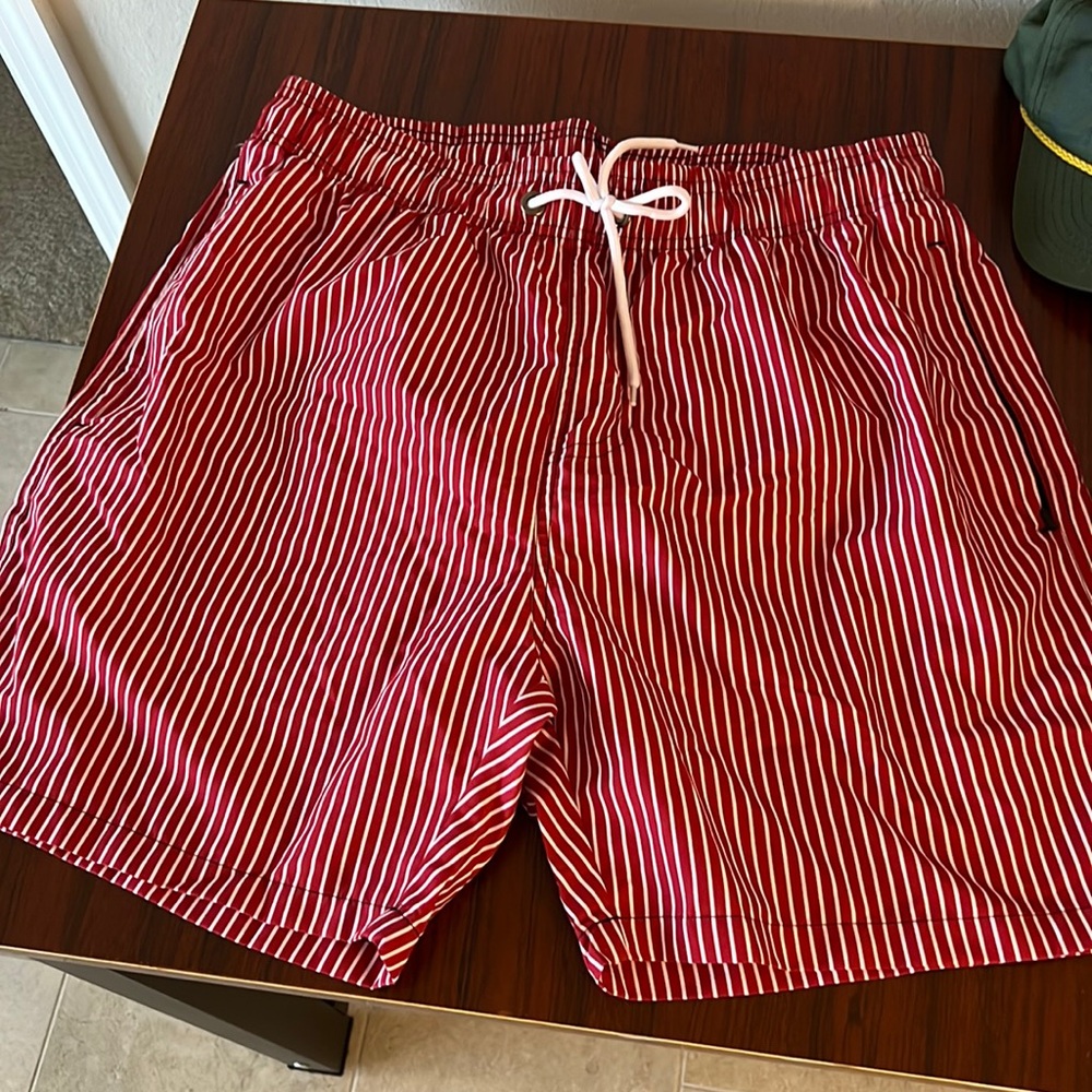 Men’s red and white swim suit size large